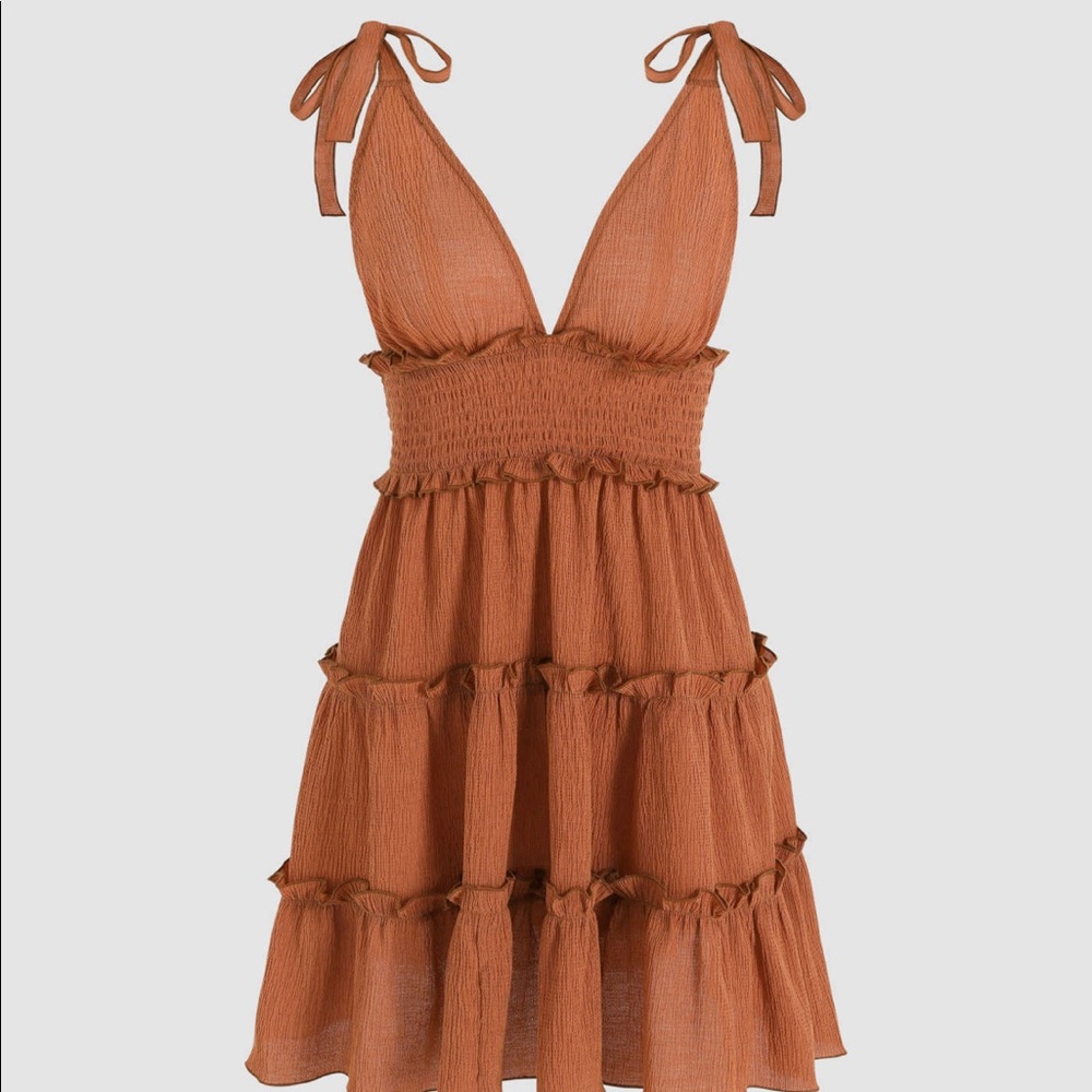 Solid shirred ruffle mini dress in the color orange!